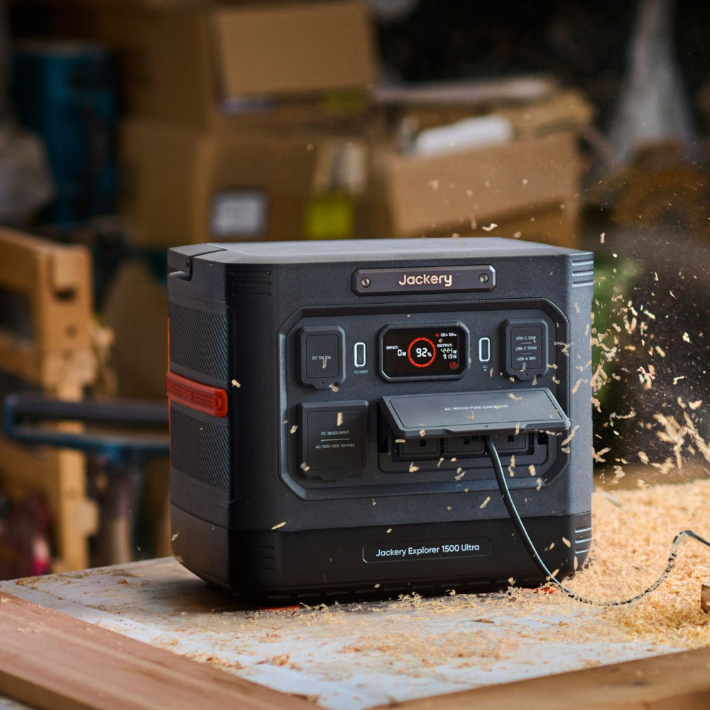 Jackery Explorer 1500 Ultra Portable Power Station on a workbench with sawdust and boxes in the background