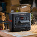Jackery Explorer 1500 Ultra Portable Power Station on a workbench with sawdust and boxes in the background