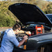 A Man Jumpstarting A Car With Wagan Tech JumpBoost V8 Air