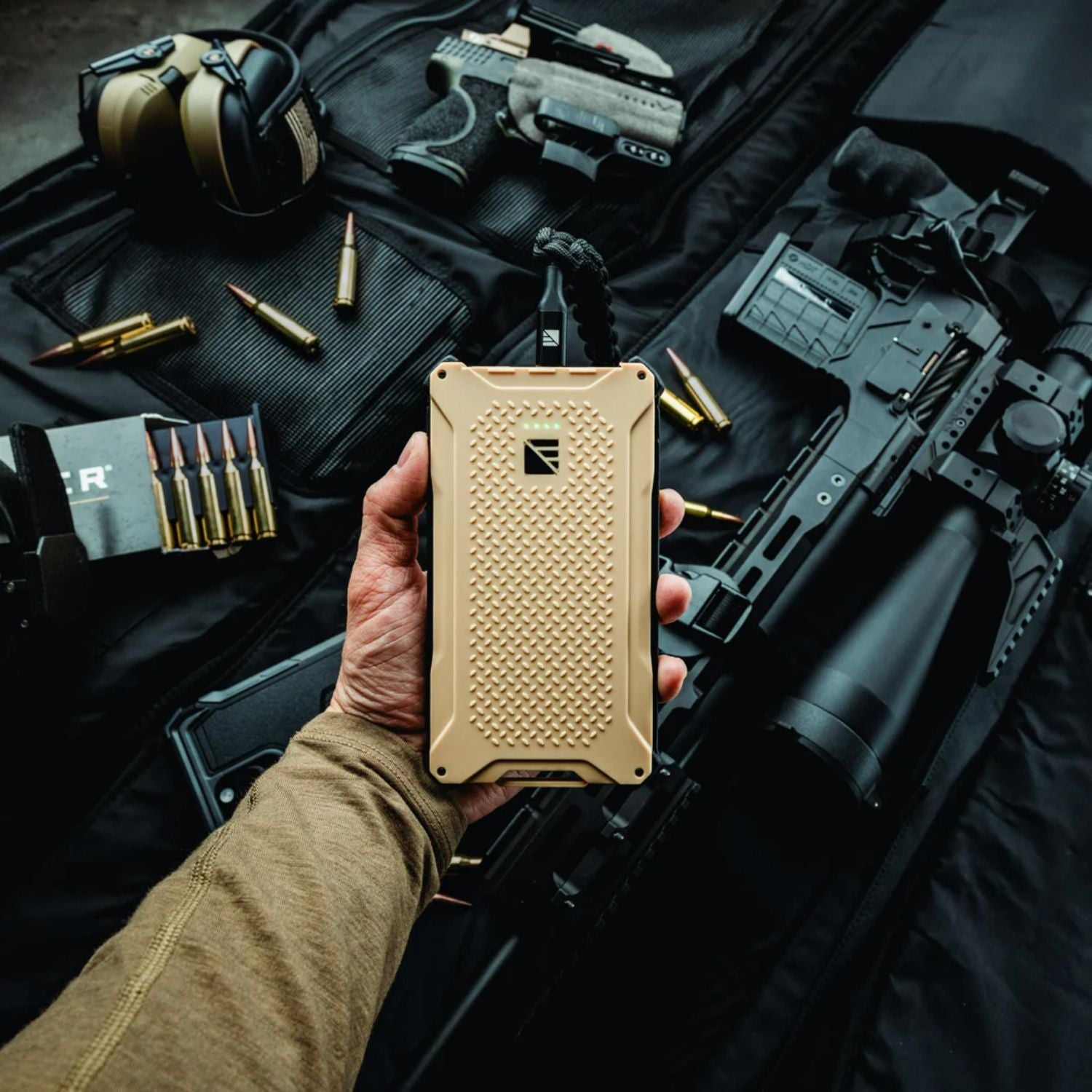A man holding Dark Energy Poseidon Pro Power Bank - Desert 