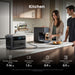 Anker SOLIX C1000 Gen 2 Portable Power Station on a kitchen counter with appliances and people in the background