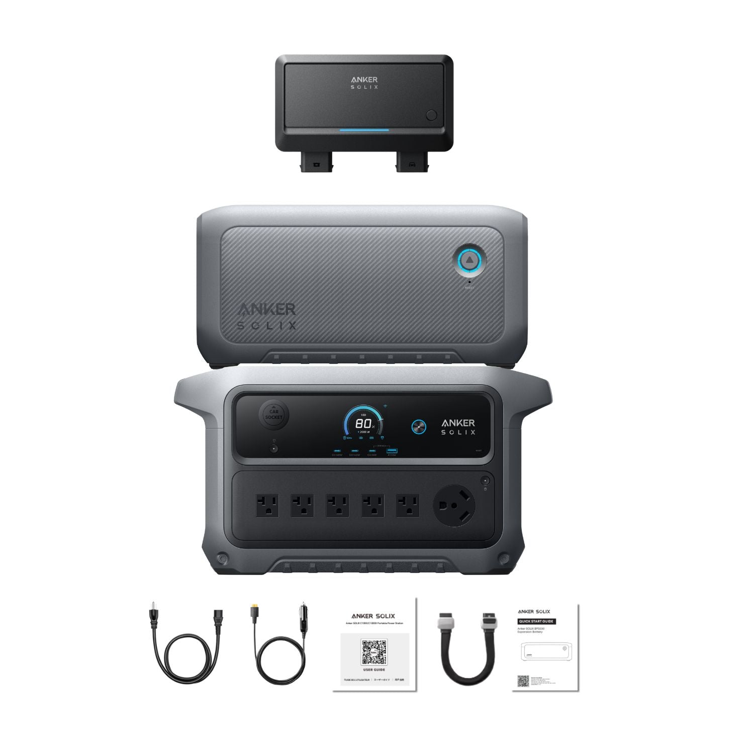 Anker SOLIX C2000 Gen 2 Portable Power Station with extra battery, car alternator and  cables and documentation on a white background 