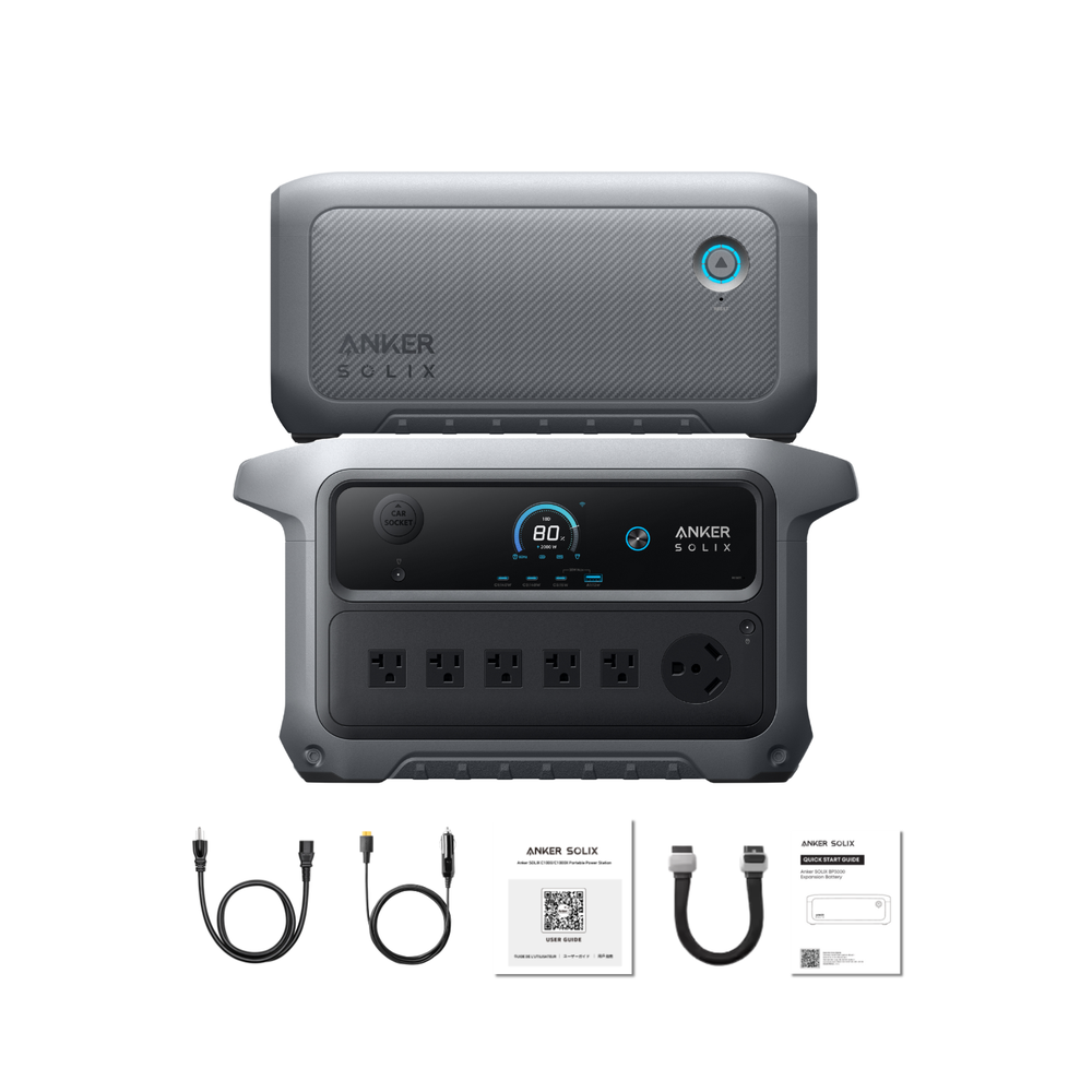 Anker SOLIX C2000 Gen 2 Portable Power Station with extra battery and  cables and documentation on a white background
