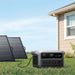 Anker SOLIX C2000 Gen 2 Portable Power Stationwith solar panels in front of a house
