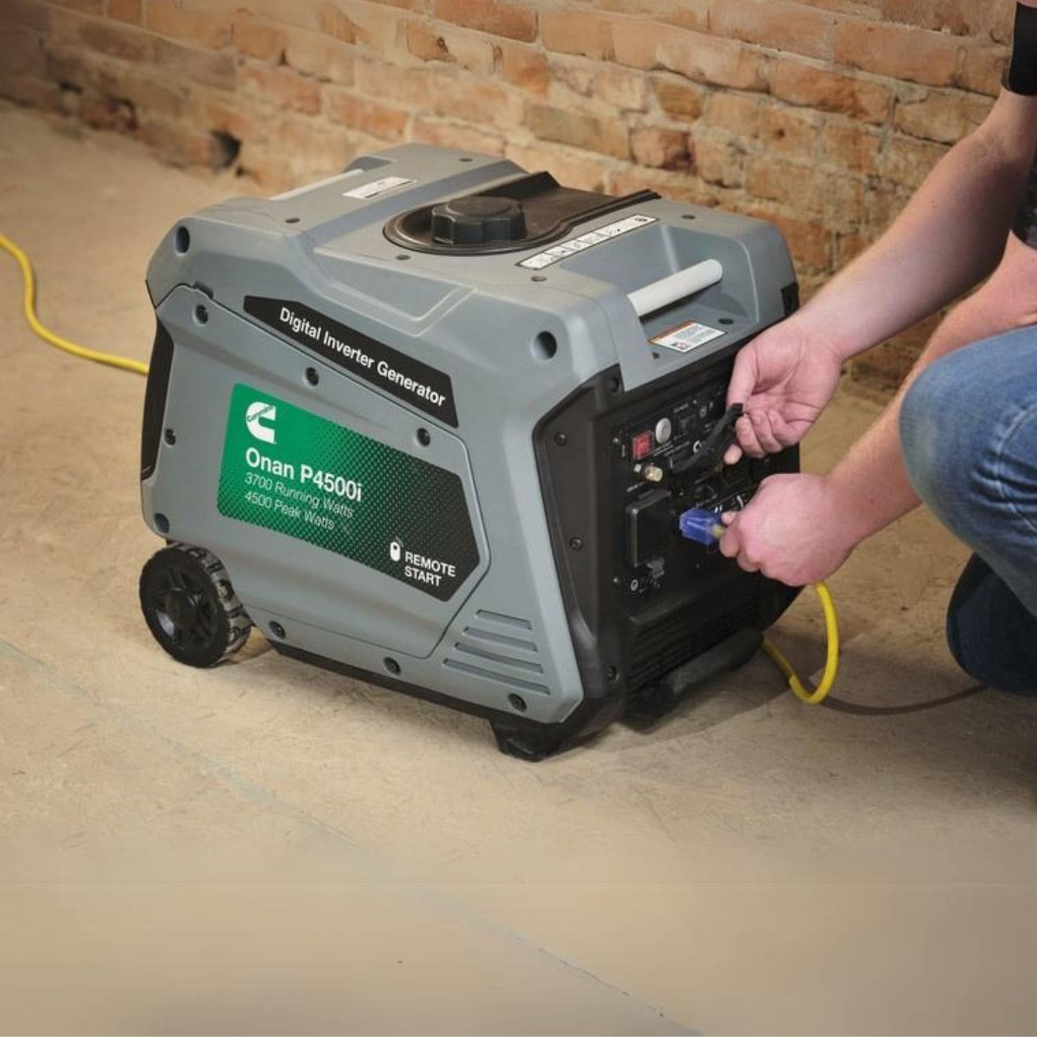 Cummins Onan P4500i Inverter Generator with a man operating it