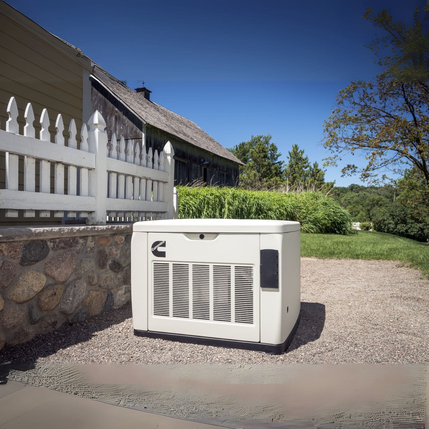 Cummins RS17A 17kW Home Standby Generator installed beside the fence