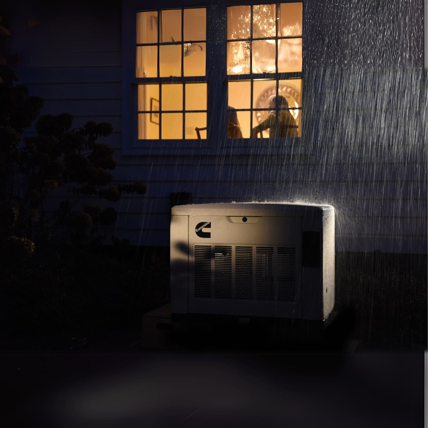 Cummins RS20A 20kW Home Standby Generator installed outside at night