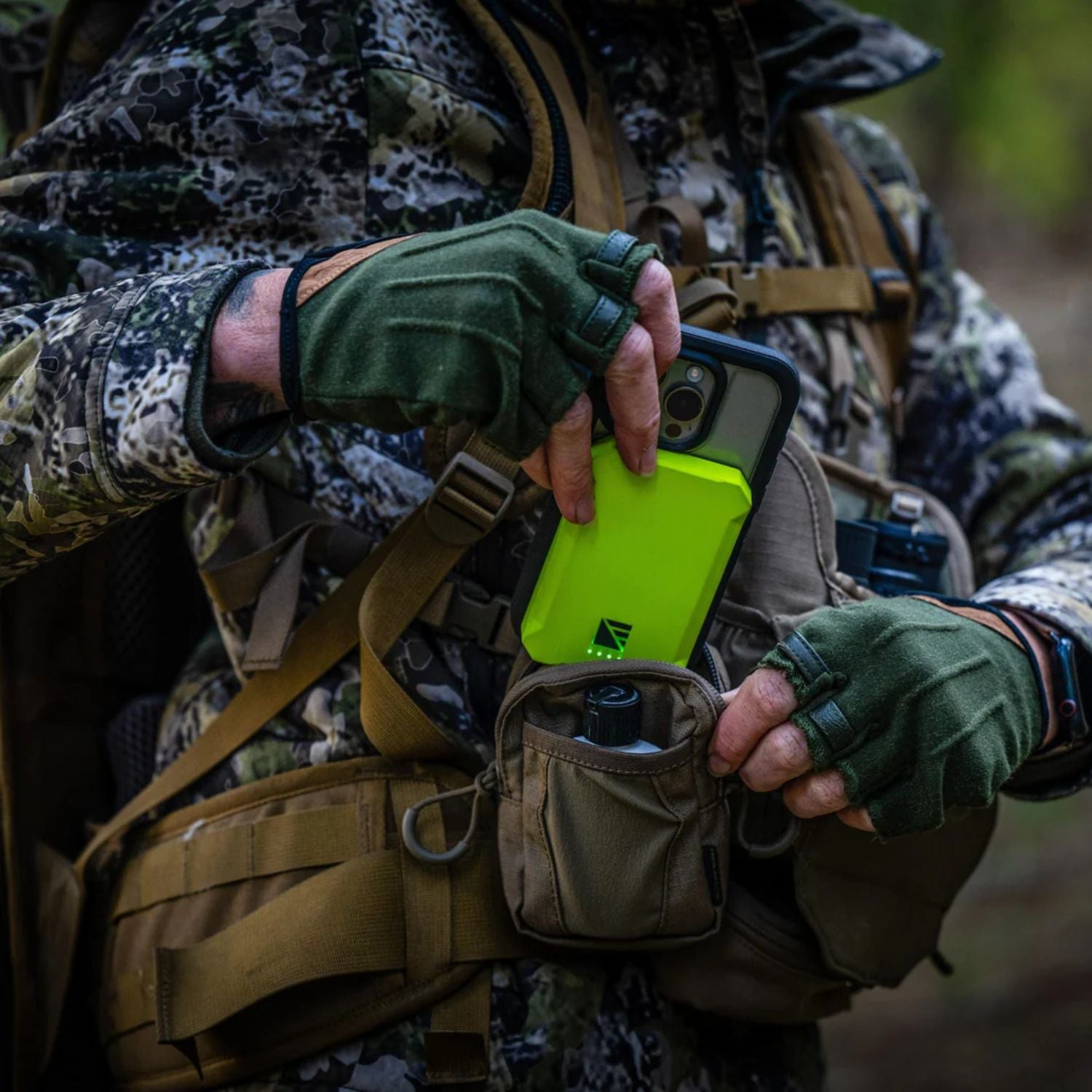 Dark Energy Poseidon Nano Power Bank - Green attached to a phone 