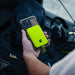 Dark Energy Poseidon Nano Power Bank - Green magnetically attached to a iphone held by a man.Dark Energy Poseidon Nano Power Bank - Green magnetically attached to a iphone held by a man.