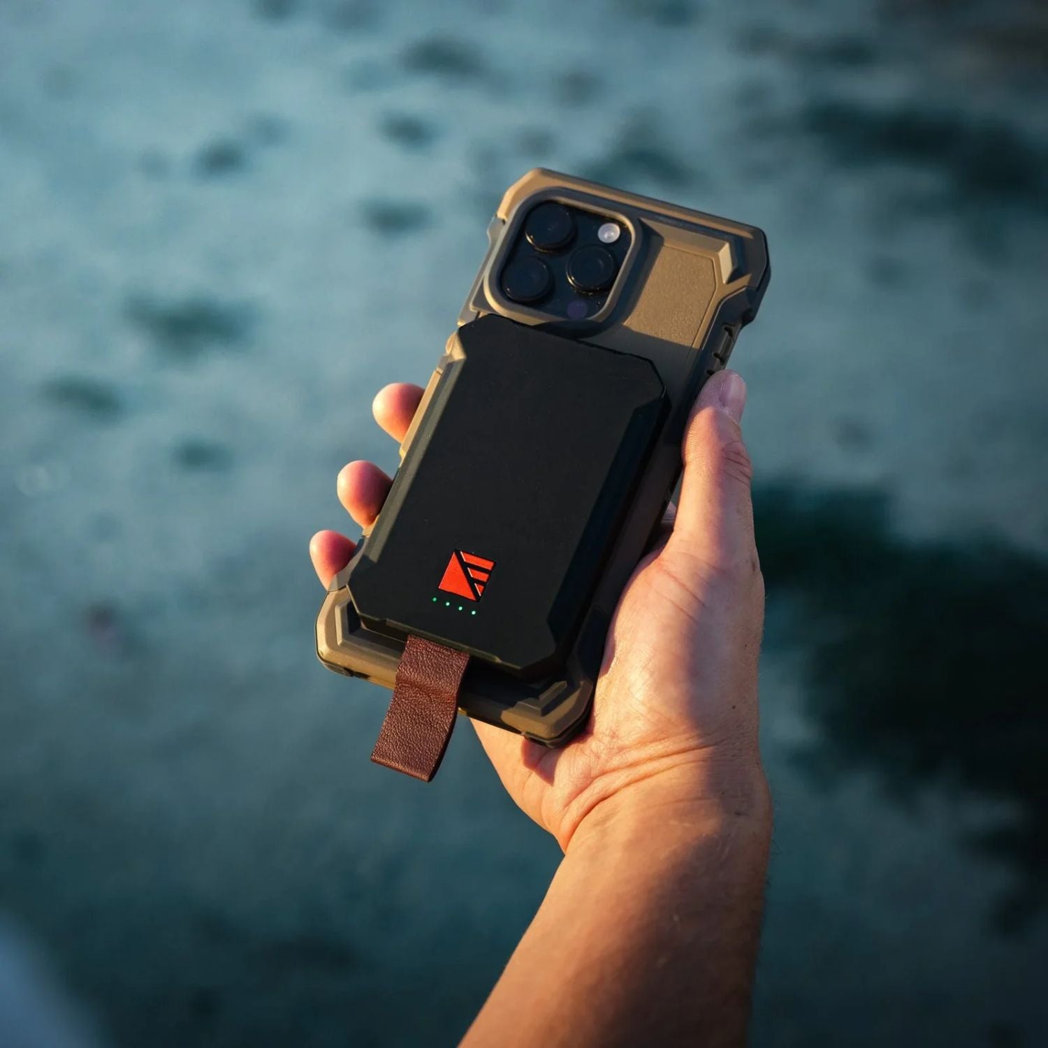 Dark Energy Poseidon Nano Power Bank Black attached to a phone 