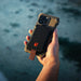 Dark Energy Poseidon Nano Power Bank Black attached to a phone 