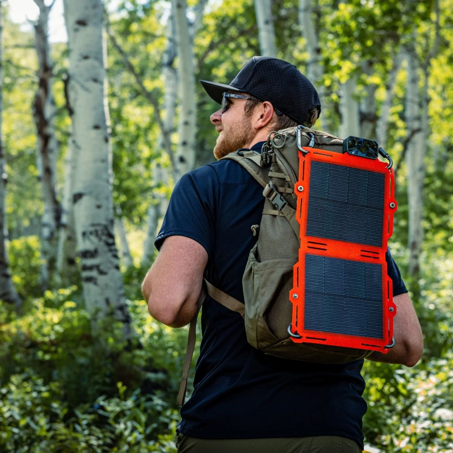 Dark Energy Spectre 8W Solar Panel - Orange attached to a backpack