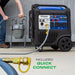 DuroMax XP11000iHT Portable Inverter Generator  with quick connect hose attachment on a concrete surface.