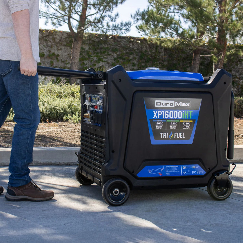DuroMax XP16000iHT Tri-Fuel Generator  being pushed by a person outdoors