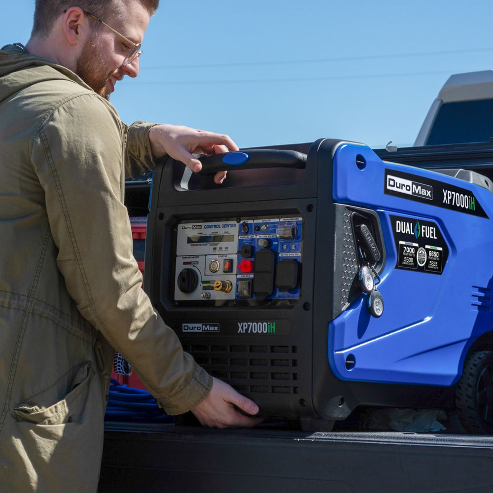 DuroMax XP7000iH Generator man holding 