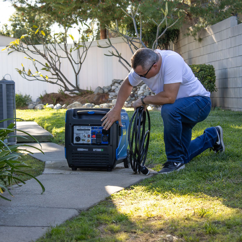 DuroMax XP7000iH Generator man turning on