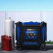 Duro Max XP16000HT tri-fuel generator with fuel canister and propane tank on a clear day.