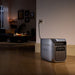 EcoFlow DELTA 3 Max Plus Portable Power Station on a wooden floor with a dimly lit room in the background