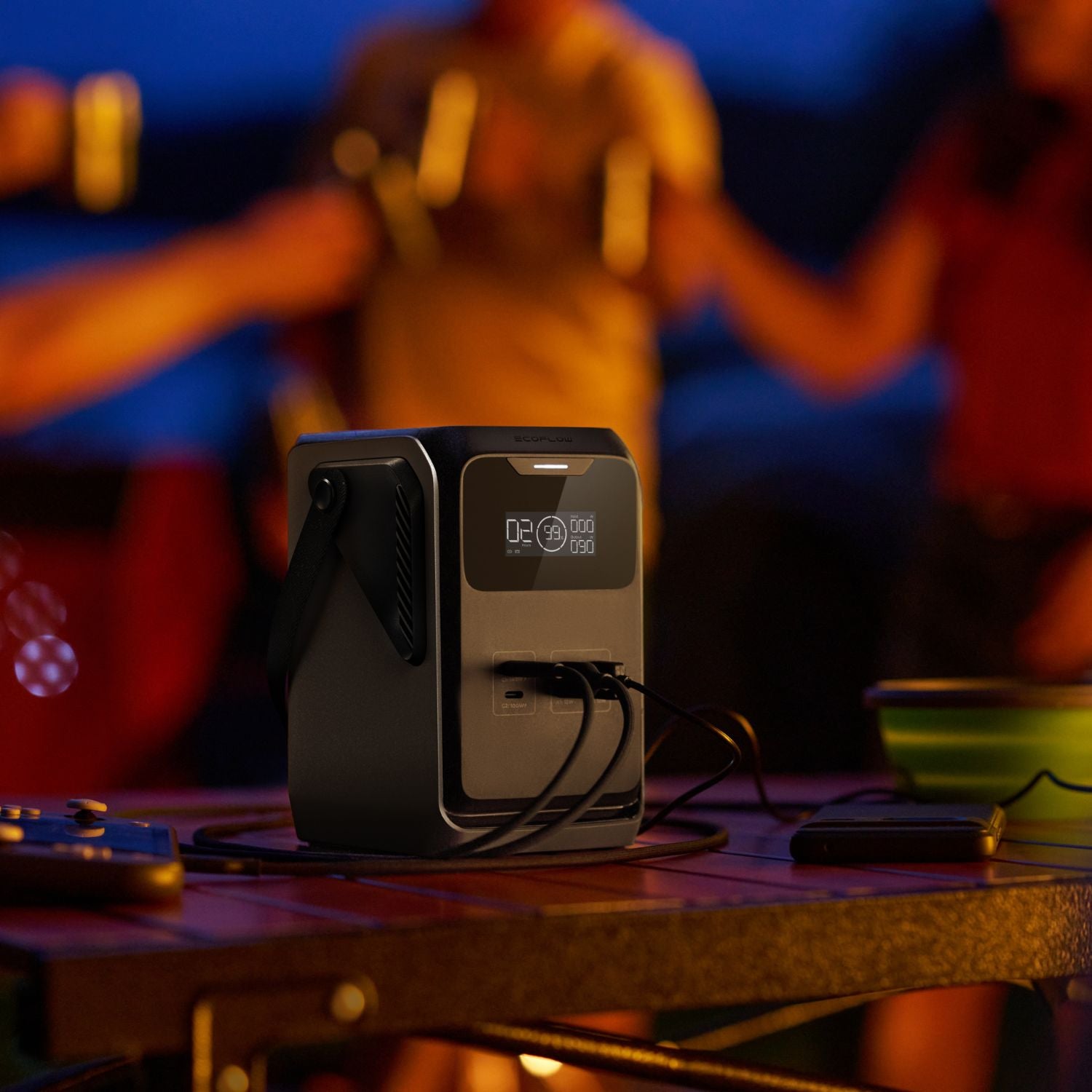 EcoFlow TRAIL 200DC Portable Power Station on a table with people in the background