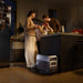 Family in a kitchen with a EcoFlow DELTA 3 Ultra Portable Power Station on the floor