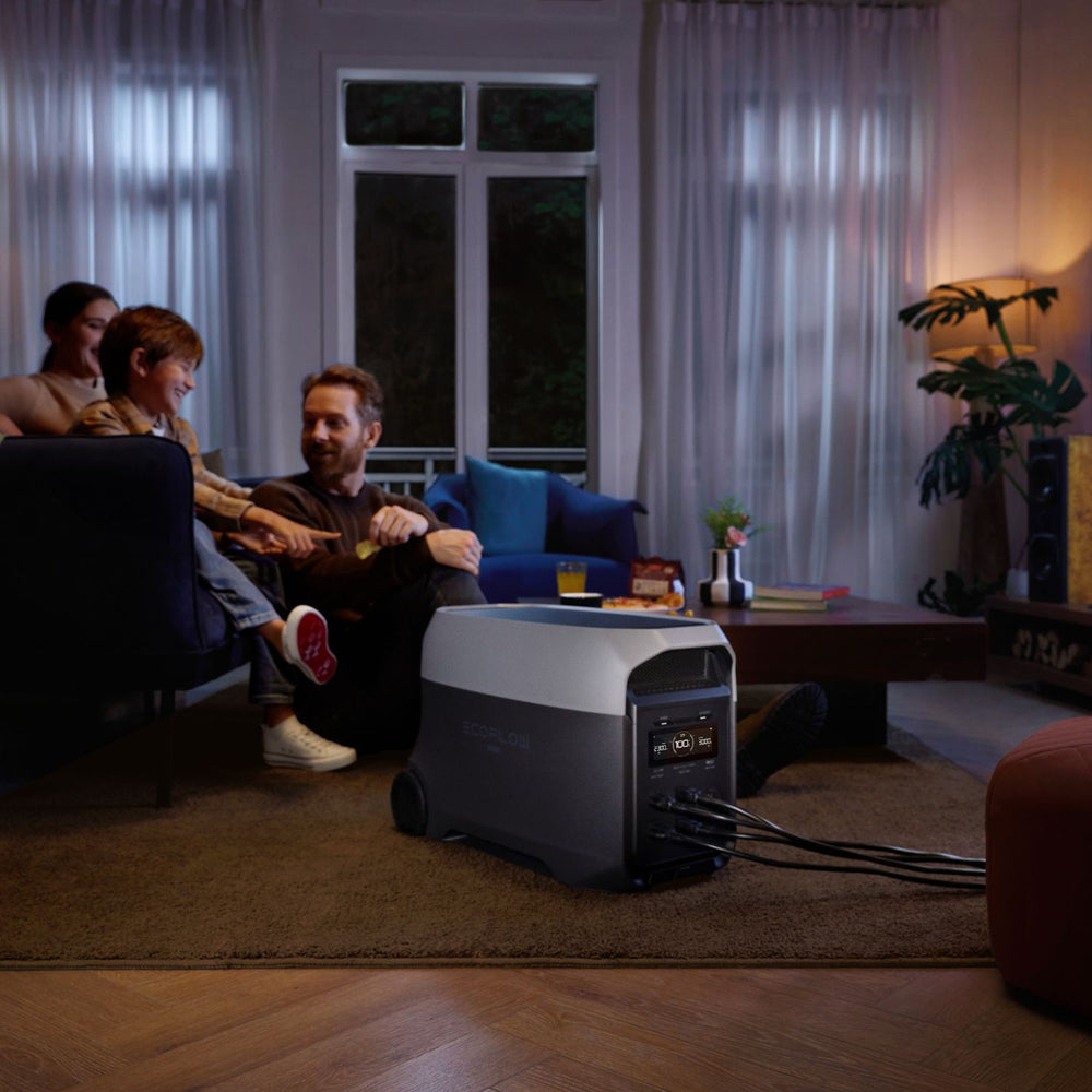 Family sitting in a living room with a EcoFlow DELTA 3 Ultra Portable Power Station during a power outage.