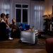 Family sitting in a living room with an EcoFlow DELTA 3 Ultra Plus Portable Power Station on a coffee table.