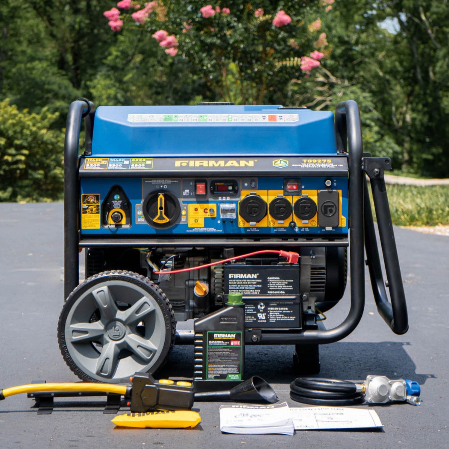 Firman T09275 Tri Fuel Portable Generator 11400W with included package accessories in front