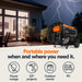 Generac’s GP8000E Portable Generator in front of a house with lightning in the background, emphasizing portable power solutions.