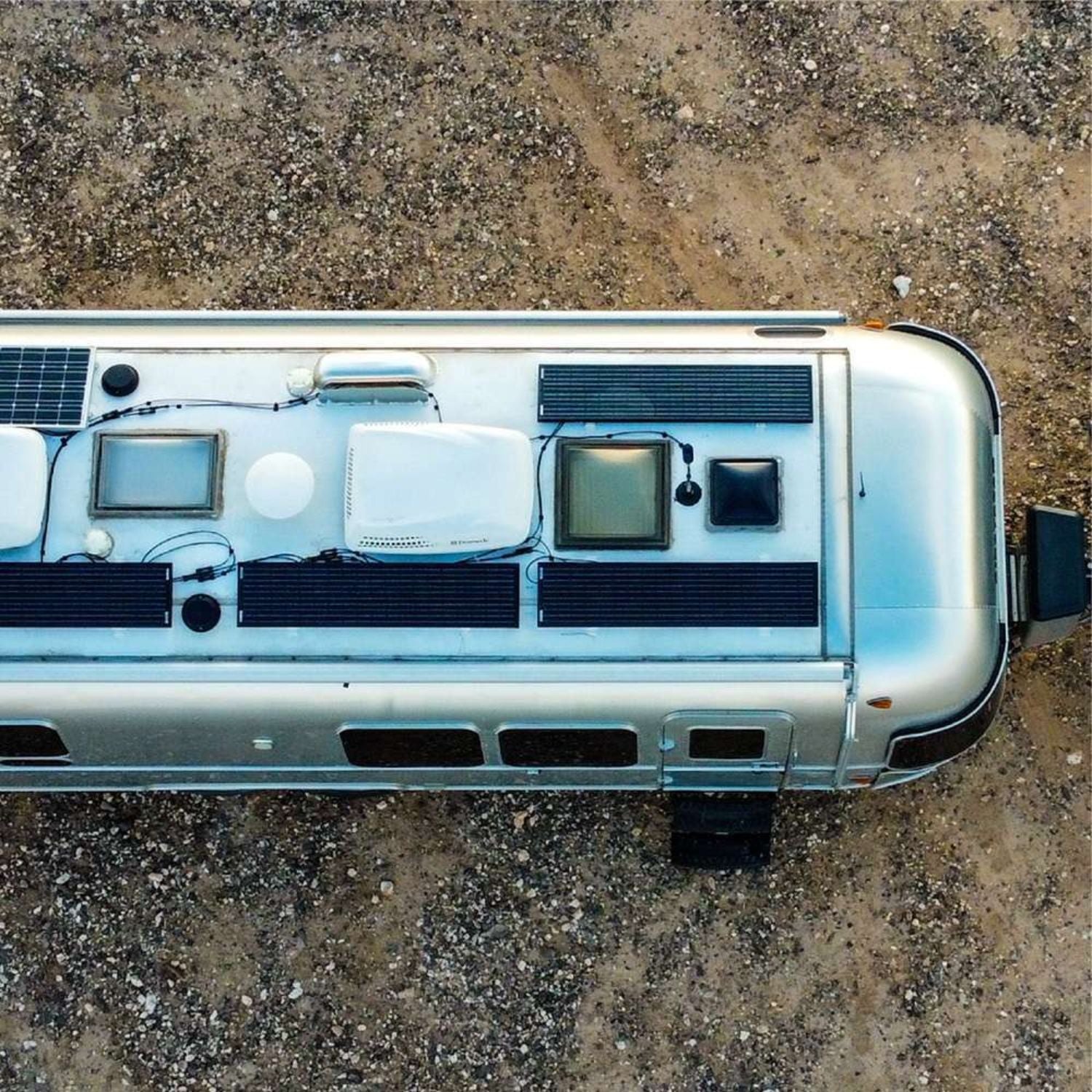 Go Power! Black SLIM Solar Kit 100 WATTS Solar Controller above the camping truck