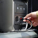 Hand plugging a cable into a EcoFlow DELTA 3 Max Plus Portable Power Station