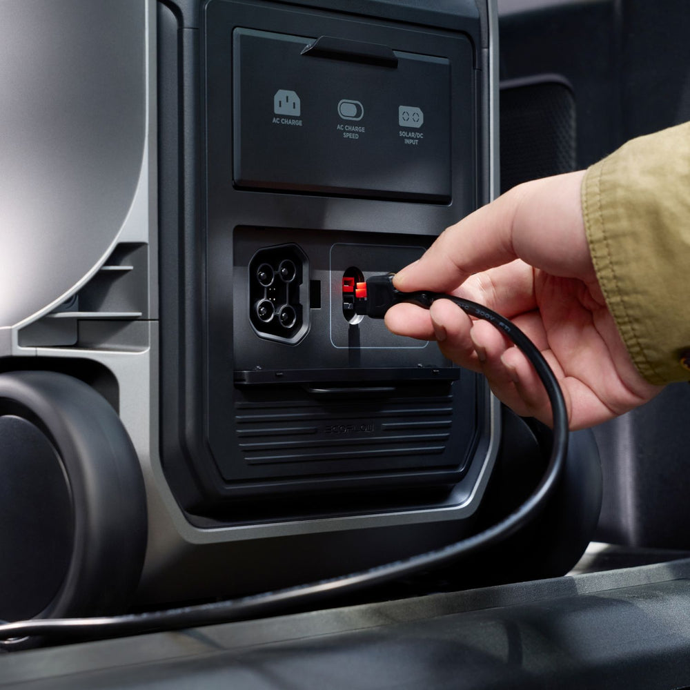 Hand plugging a charging cable into a EcoFlow DELTA 3 Ultra Plus Portable Power Station charging port.