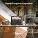 Jackery Explorer 600 v2 with a coffee machine on a camping setup, featuring 'Power Freedom Anywhere' text.