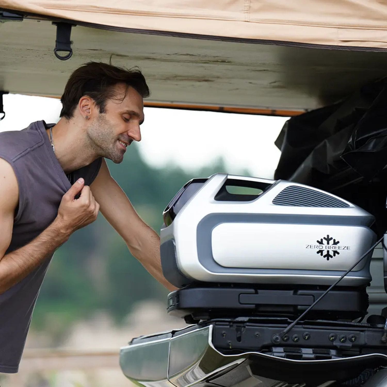 Man Enjoying A ZERO BREEZE Mark 3 While It Sits On The Bed Of A Truck