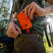 Man Putting Dark Energy Poseidon Nano Power Bank - Orange into his pocket