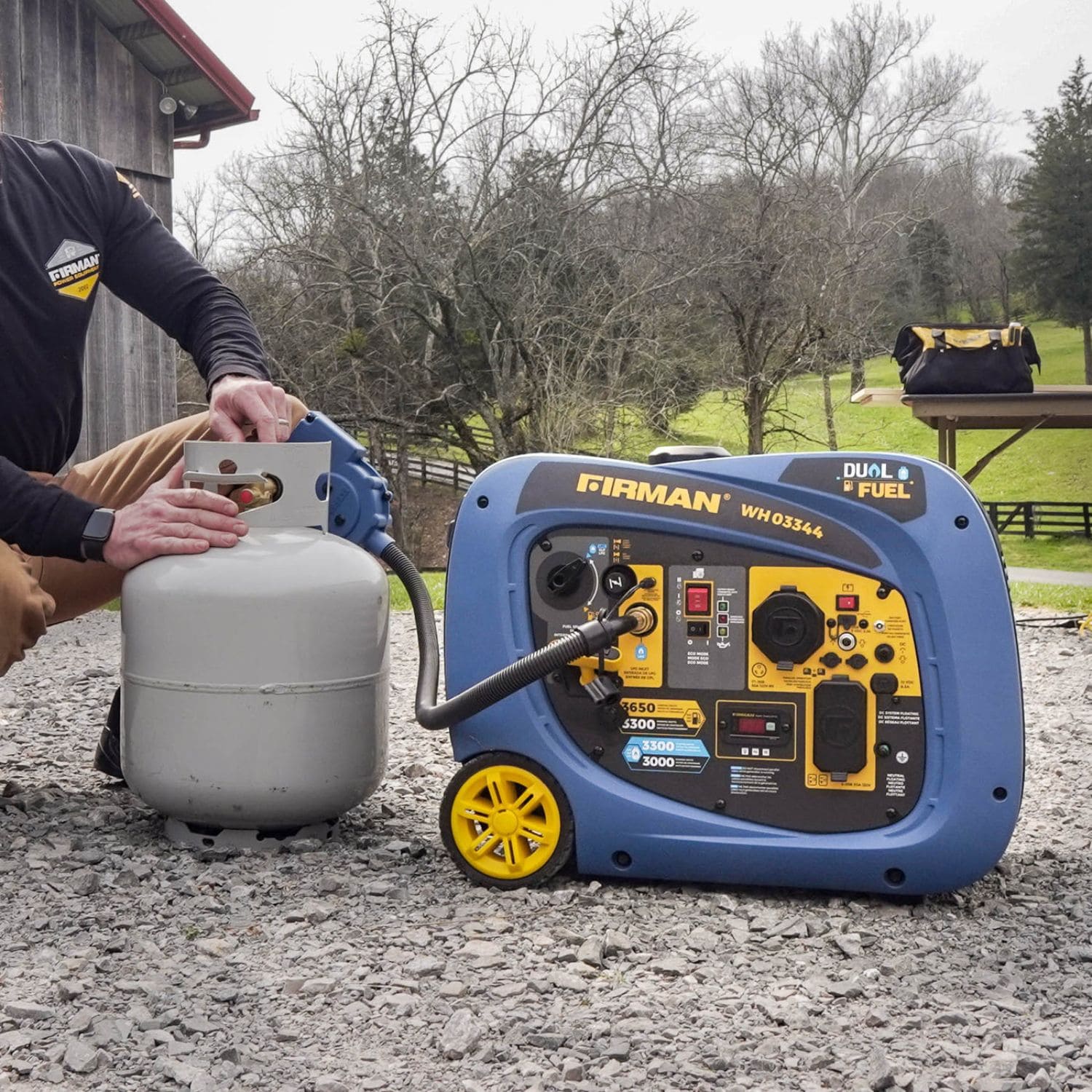 Man attaching LPG to Firman WH03344 dual fuel inverter generator 4125W