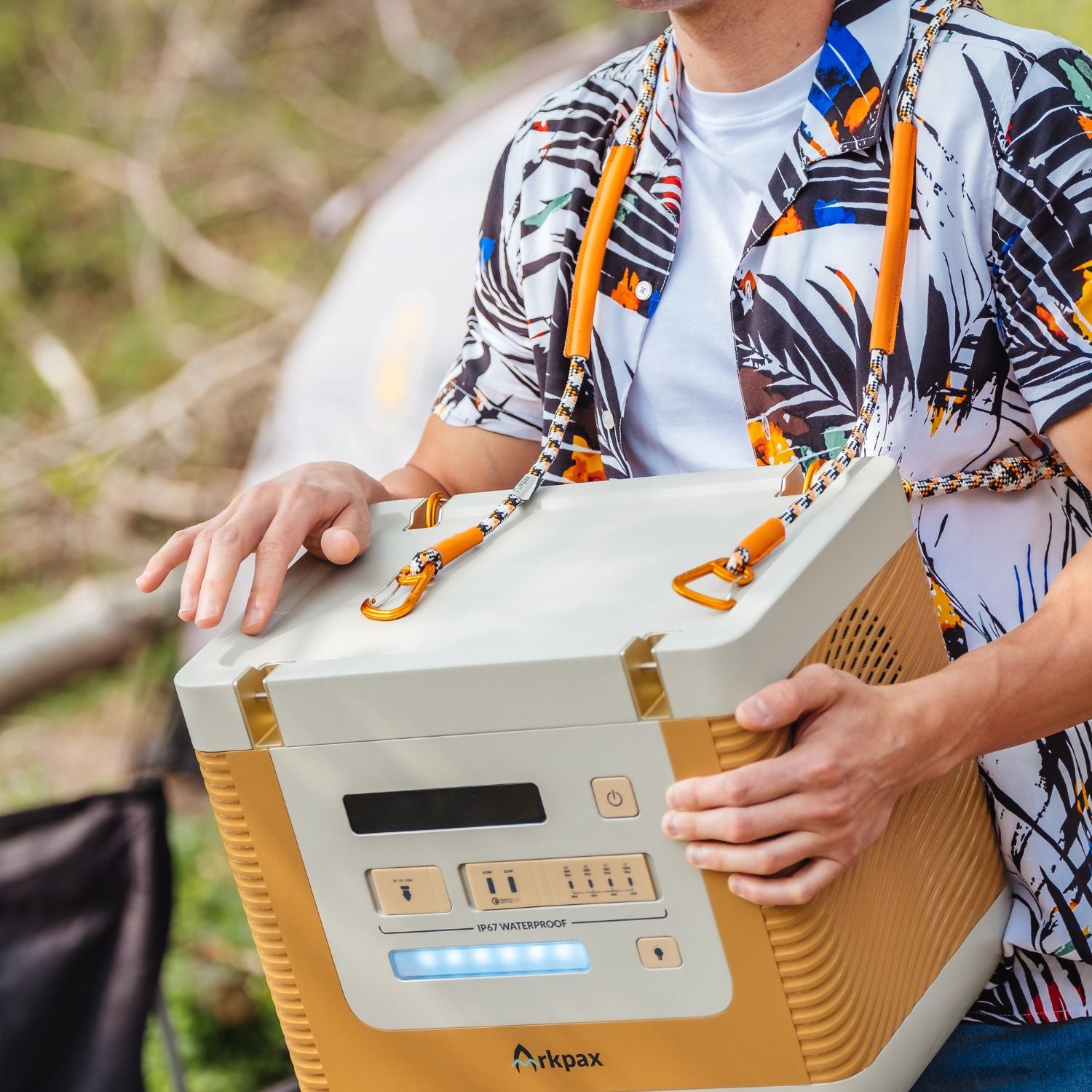 Man carrying Arkpax Ark Portable Power Station