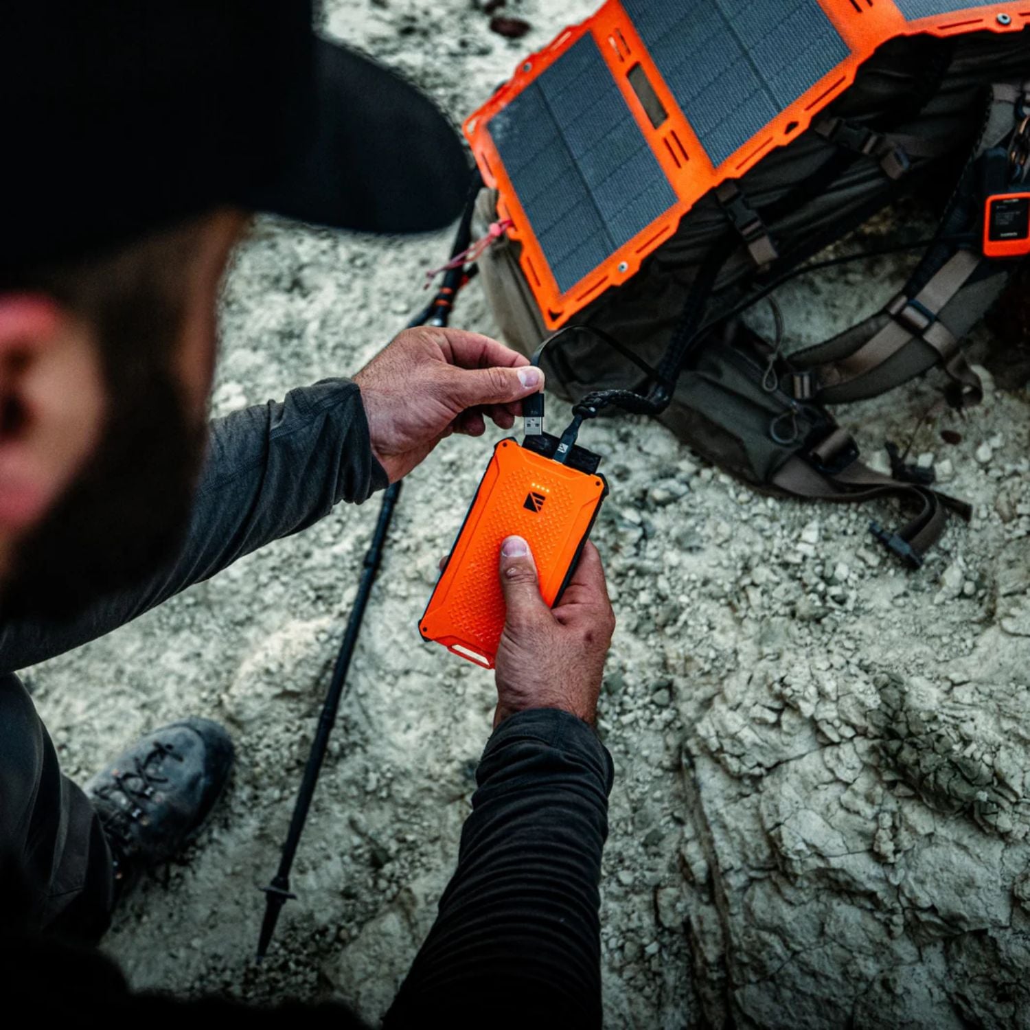 Man connect Dark Energy Poseidon Pro Power Bank - Hi-Vis Orange to a solar panel 