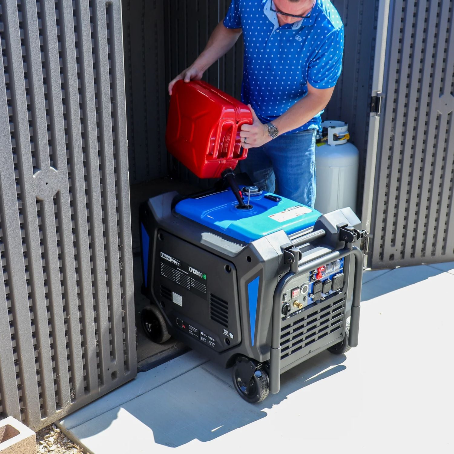 Man filling fuel to DuroMax XP13500iH Dual Fuel 