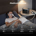 Man using a CPAP machine in bed with Anker SOLIX C1000 Gen 2 Portable Power Station on a nightstand.