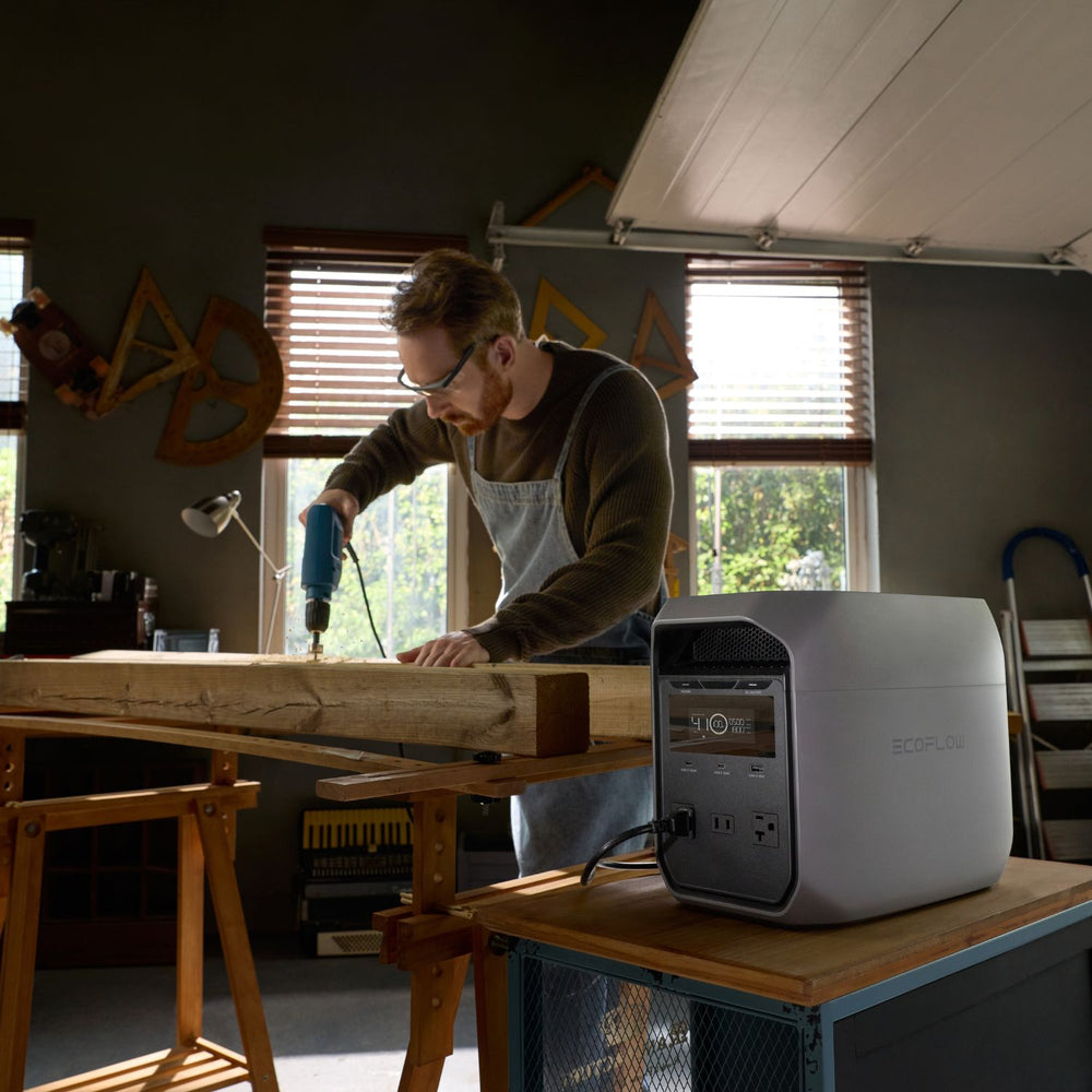 Man using a drill connected to EcoFlow DELTA 3 Classic Portable Power Station