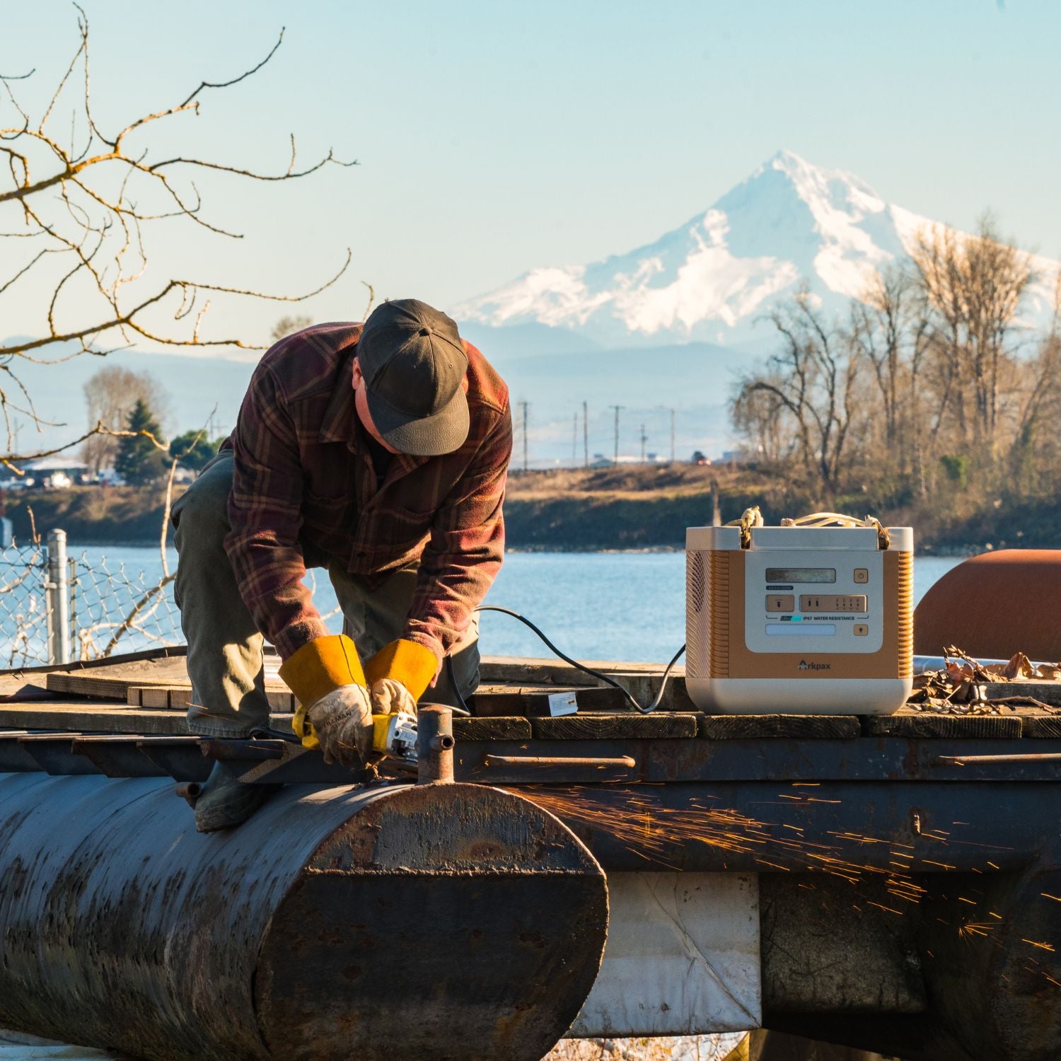 Man using a sander powered by the Arkpax Ark Evo Portable Power Station