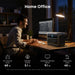 Man working at a desk with a computer and Anker SOLIX C1000 Gen 2 Portable Power Station