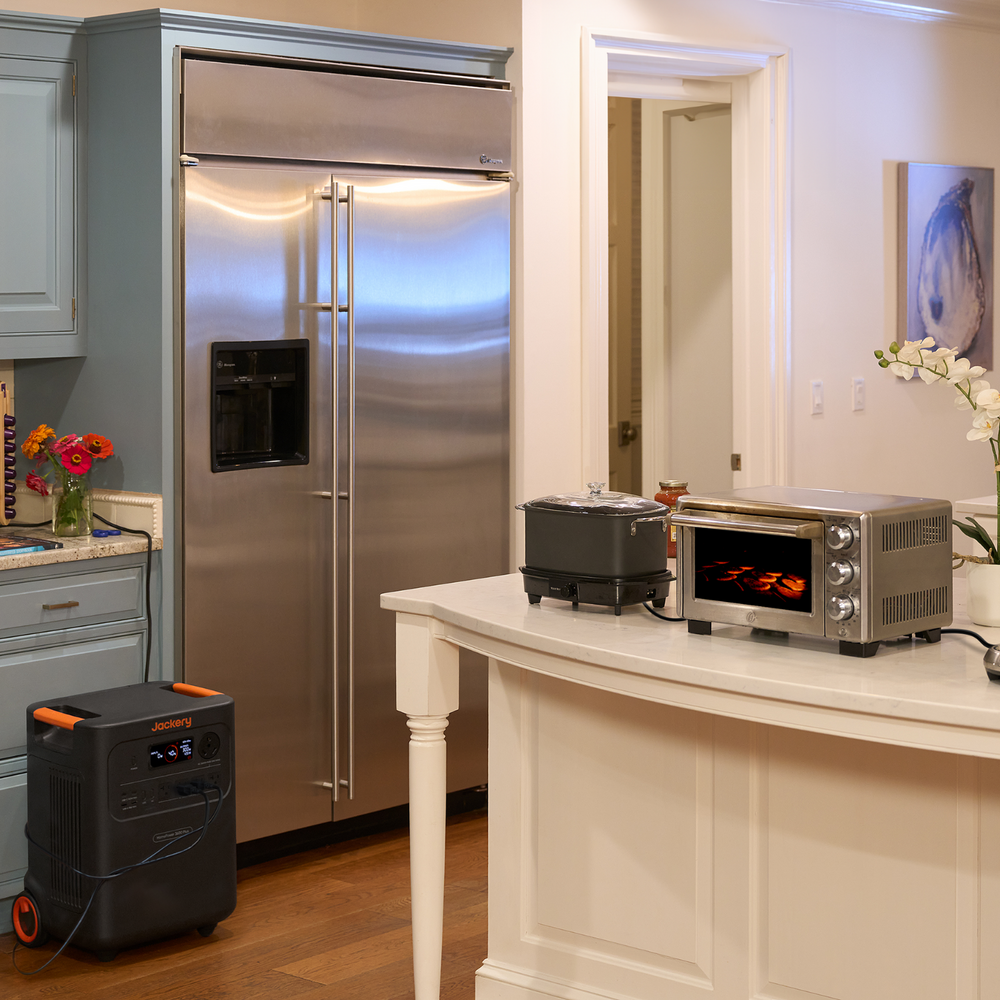Modern kitchen with stainless steel refrigerator, countertop appliances, and Jackery HomePower 3600 Plus Portable Power Station