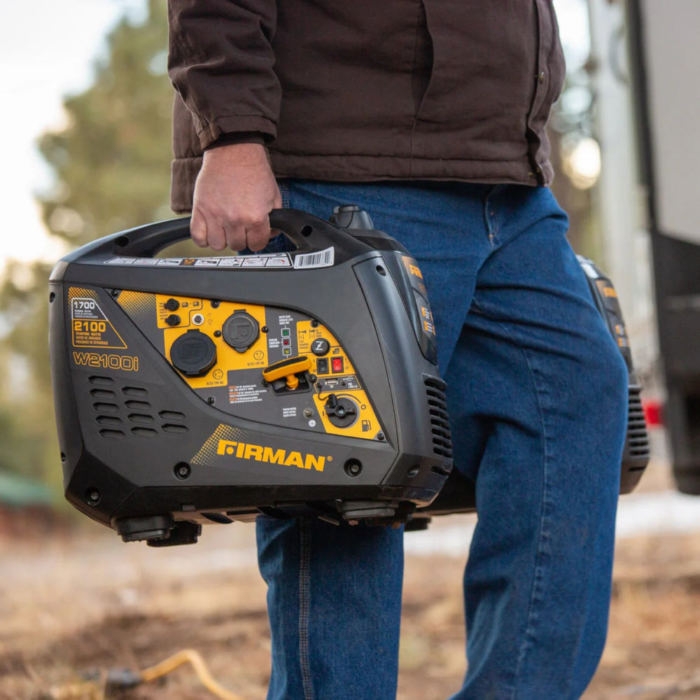 Person holding a Firman W01784 Generator outdoors