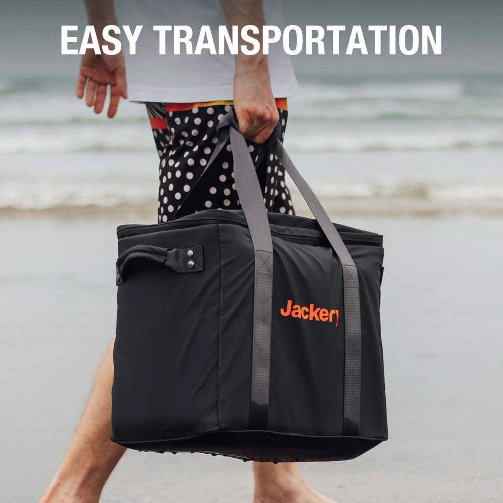 Person holding a Jackery Upgraded Carrying Case (L) on a beach.