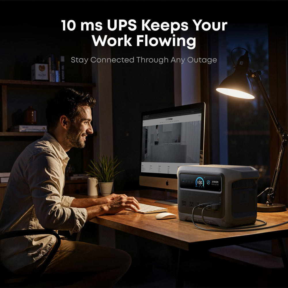 Person working at a desk with a computer and Anker SOLIX C1000 Gen 2 Portable Power Station
