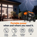 Portable generator in front of a house with lightning in the background, emphasizing portable power solutions.