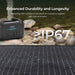 Portable power station with Renogy Solar Suitcase Kit 400W Lightweight Portable RV Kit on a rocky shore, emphasizing durability and IP67 waterproof rating.
