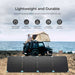 Renogy Solar Suitcase 220W Lightweight Portable Solar Panel with a car and a person sitting above the car 
