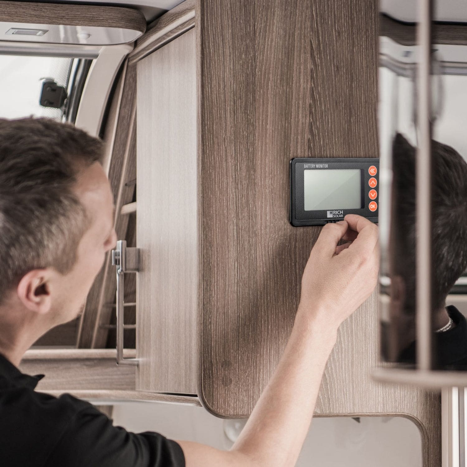 Rich Solar 500 Amp Battery Monitor being installed by a man